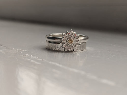 Silver flower stacking ring set.