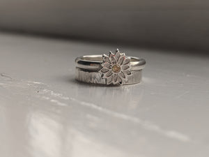 Silver flower stacking ring set.