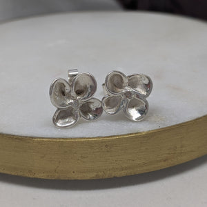 Handmade recycled silver flower earrings. 