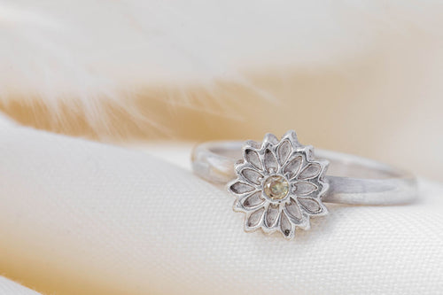 silver flower ring with cubic zirconia