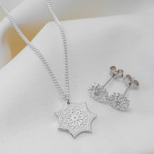 Load image into Gallery viewer, silver flower stud earrings with cubic zirconias with a silver flower style pendant on a chain. 
