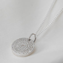 Load image into Gallery viewer, Silver aztec style circular coin pendant on a silver curb chain.
