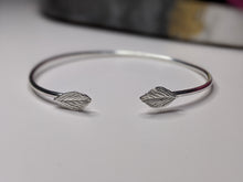 Load image into Gallery viewer, Recycled silver torque bangle with leaf details

