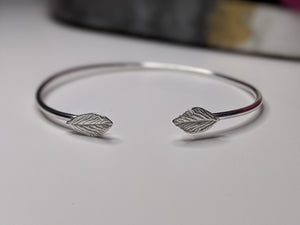 Recycled silver torque bangle with leaf details