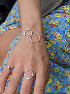 silver bracelet and silver rings