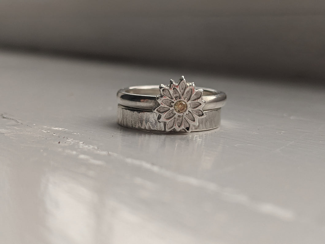 Silver flower stacking ring set.