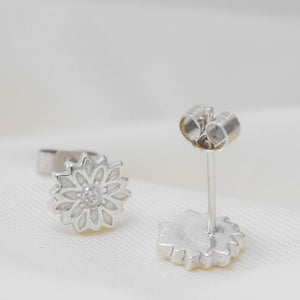 silver flower stud earrings with cubic zirconias