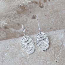 Load image into Gallery viewer, Silver oval drop earrings with indented detail
