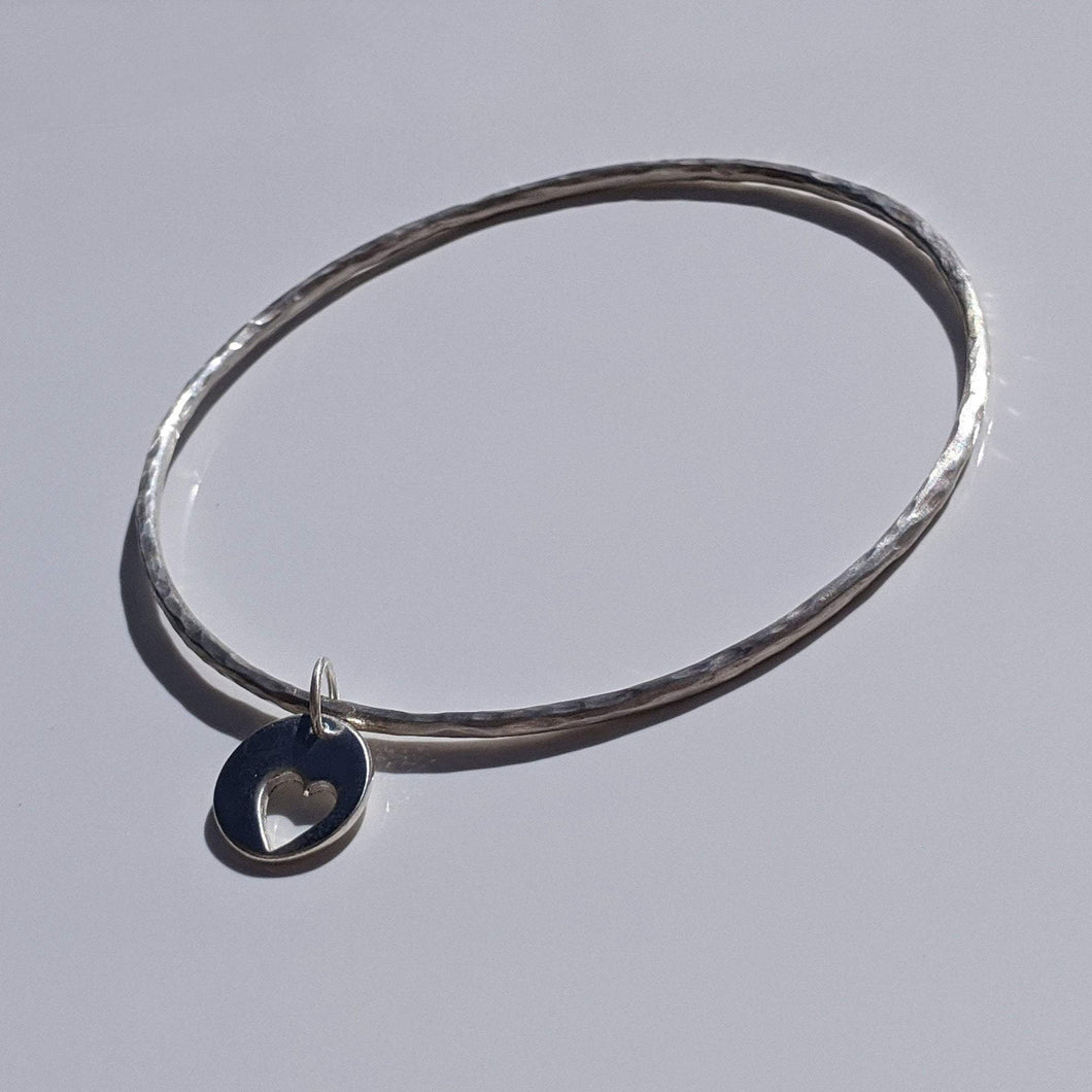 Handmade silver bangle with heart charm